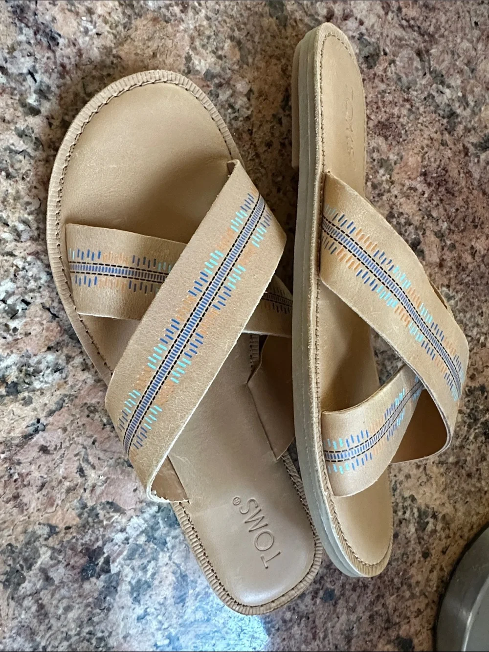 TOMS tan leather crossband slide sandals with colorful blue, aqua & orange print